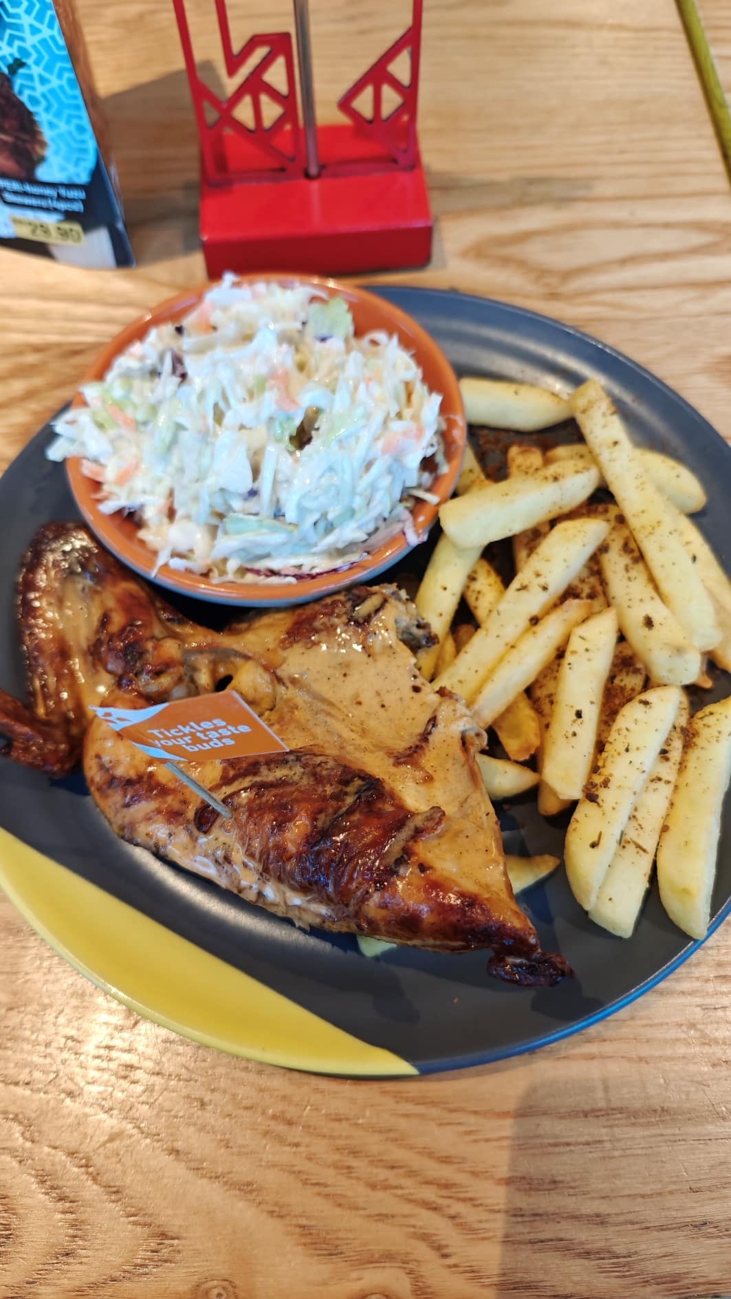 Nando’s Quarter Chicken with coleslaw and potato chips