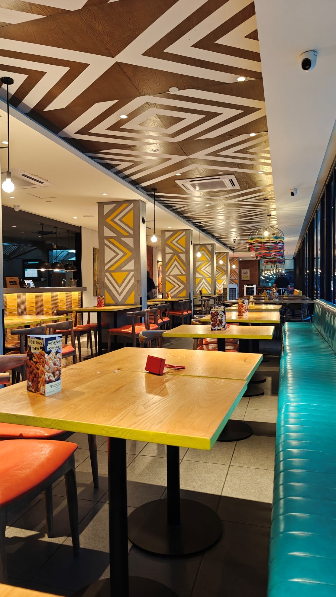 Seating area inside Nando’s Bintang Megamall