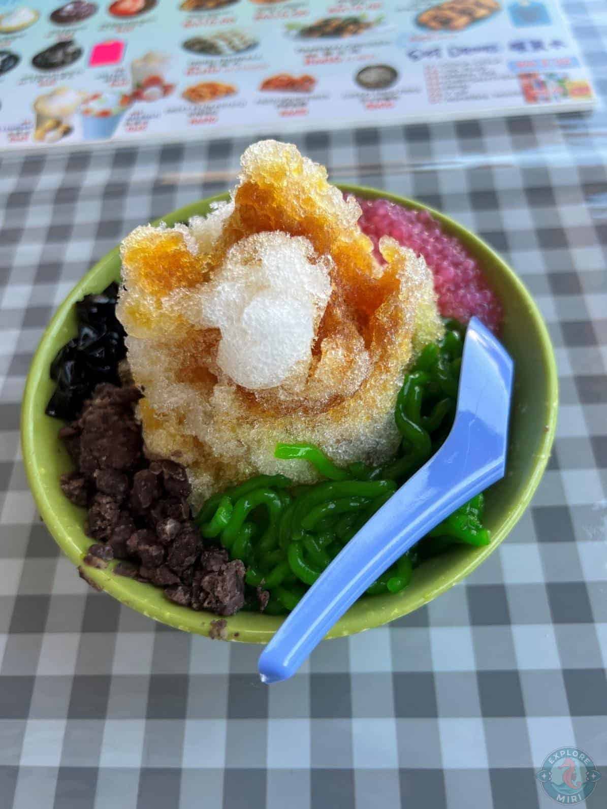 Cendol filled with Shaved Ice, Green Jelly Noodles with Yellow Jelly on top