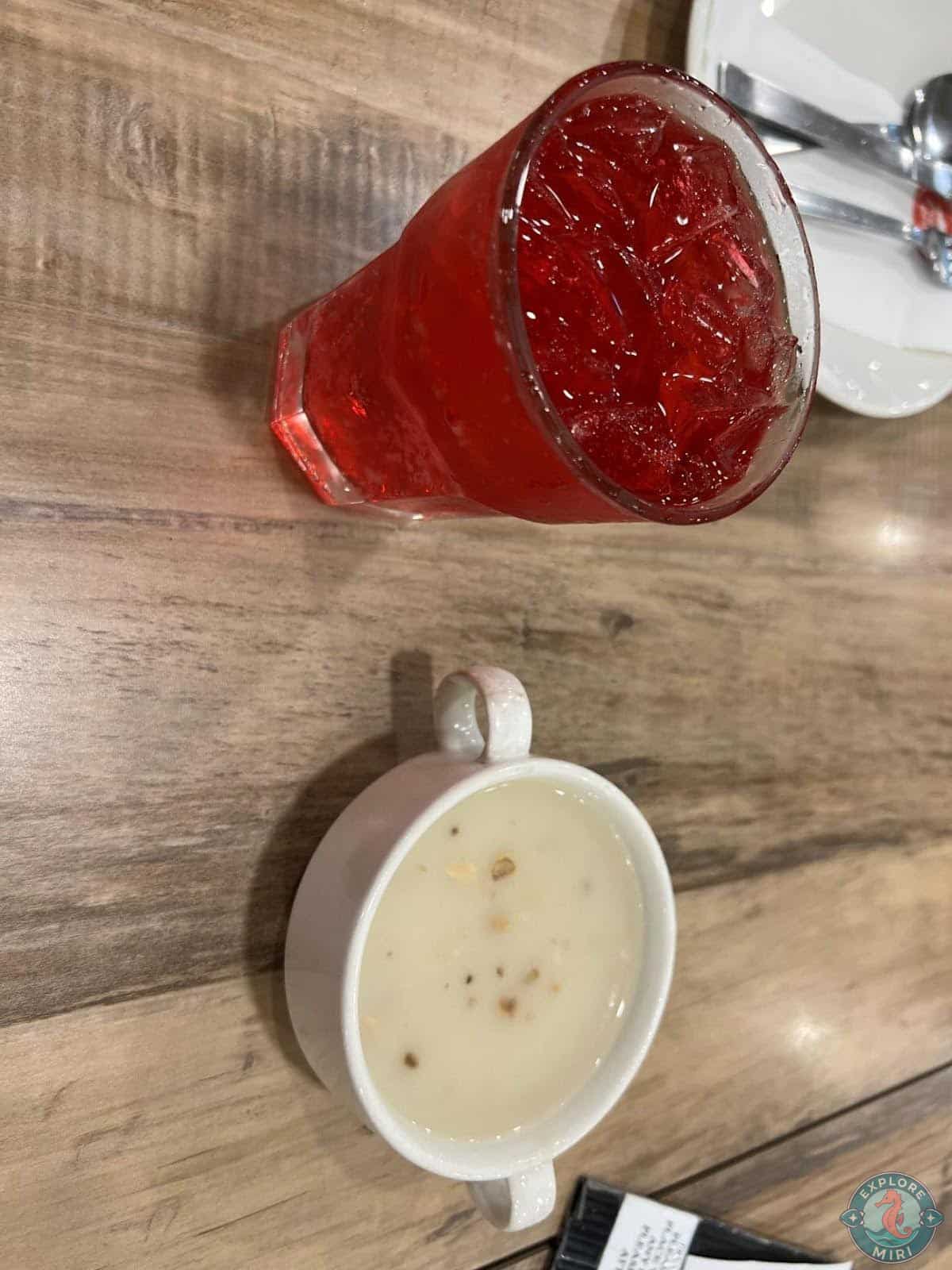 Cream of Mushroom Soup and a glass of iced Fanta Strawberry