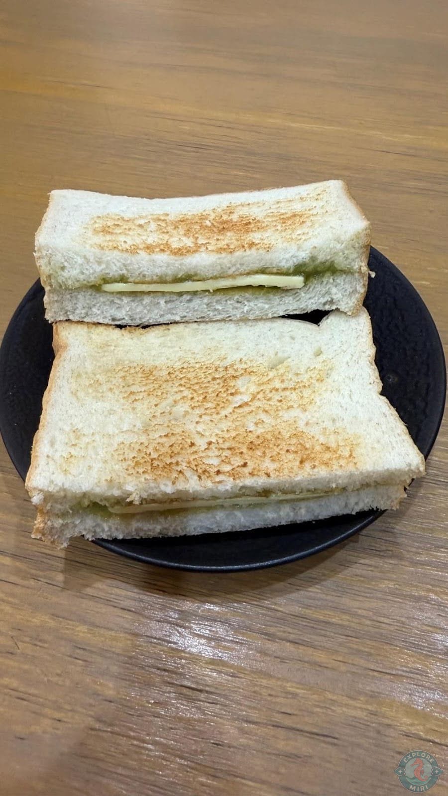 kaya butter toast with a layer of kaya on both slices and a butter slice in middle
