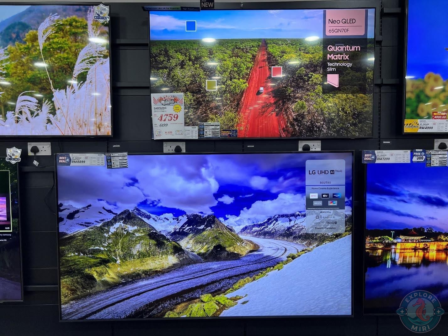rows of TVs on display showed images in various resolutions and displays