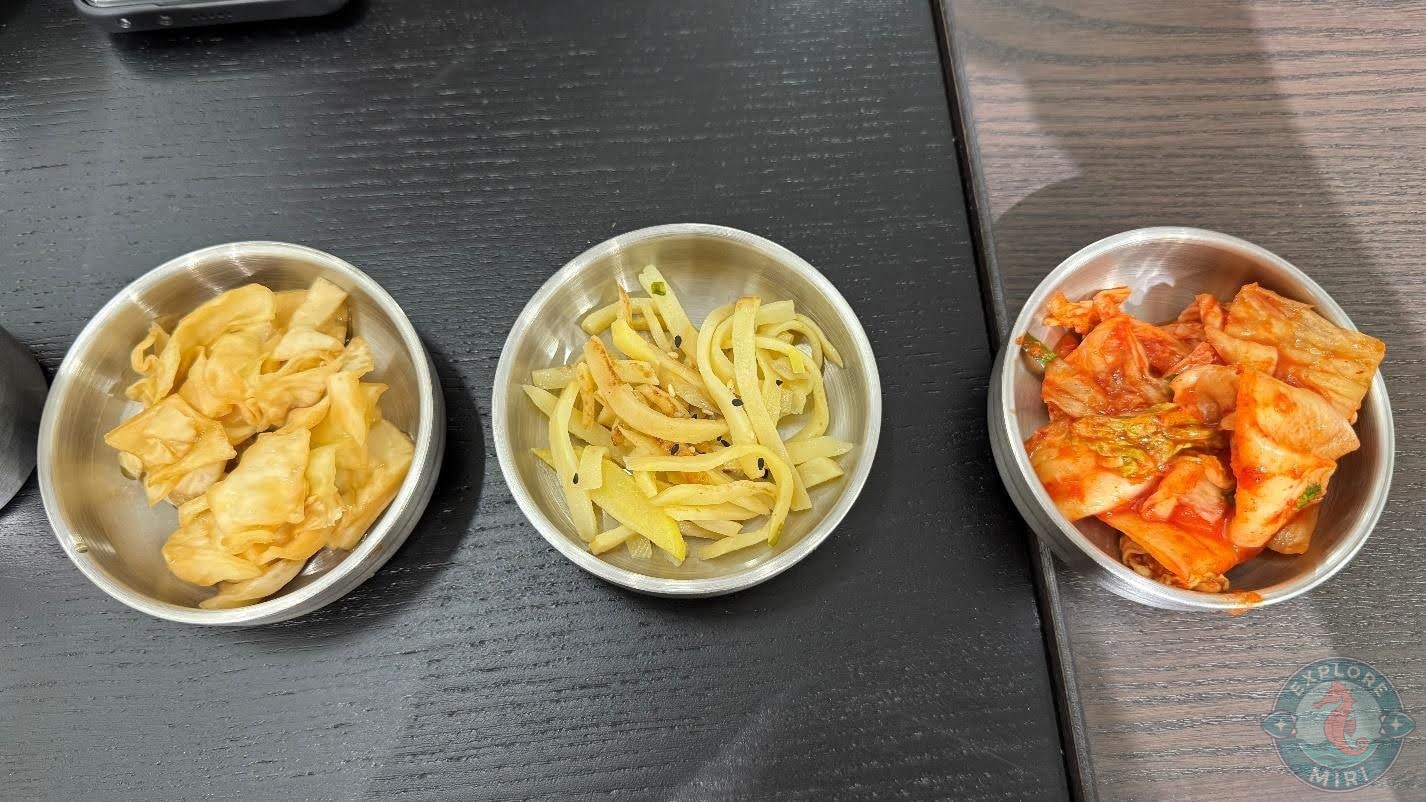 three small kimchi dishes- the classic cabbage kimchi, radish kimchi and plain cabbage kimchi