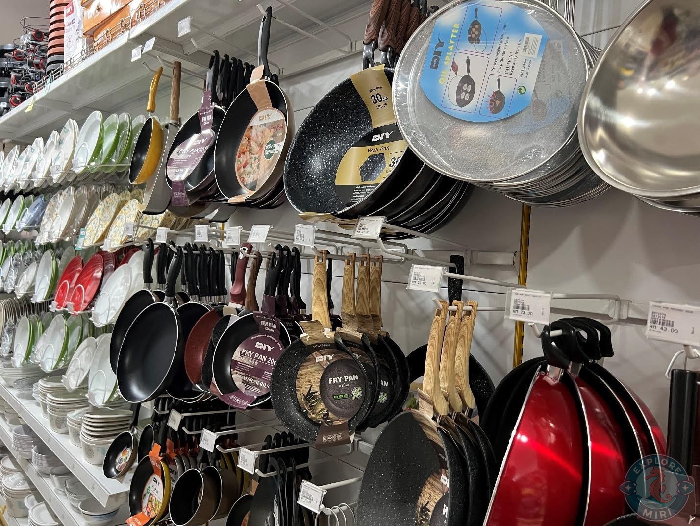 wall of pans, woks and plates