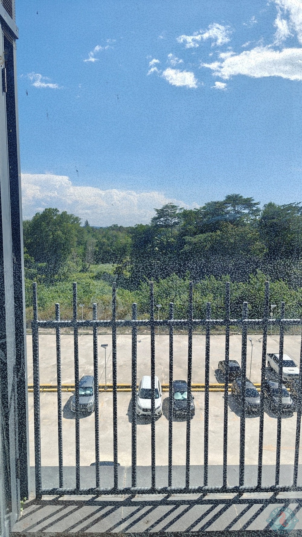 Jinhold Hotel Miri Standard Room Balcony Overlooking the Carpark and Greenary