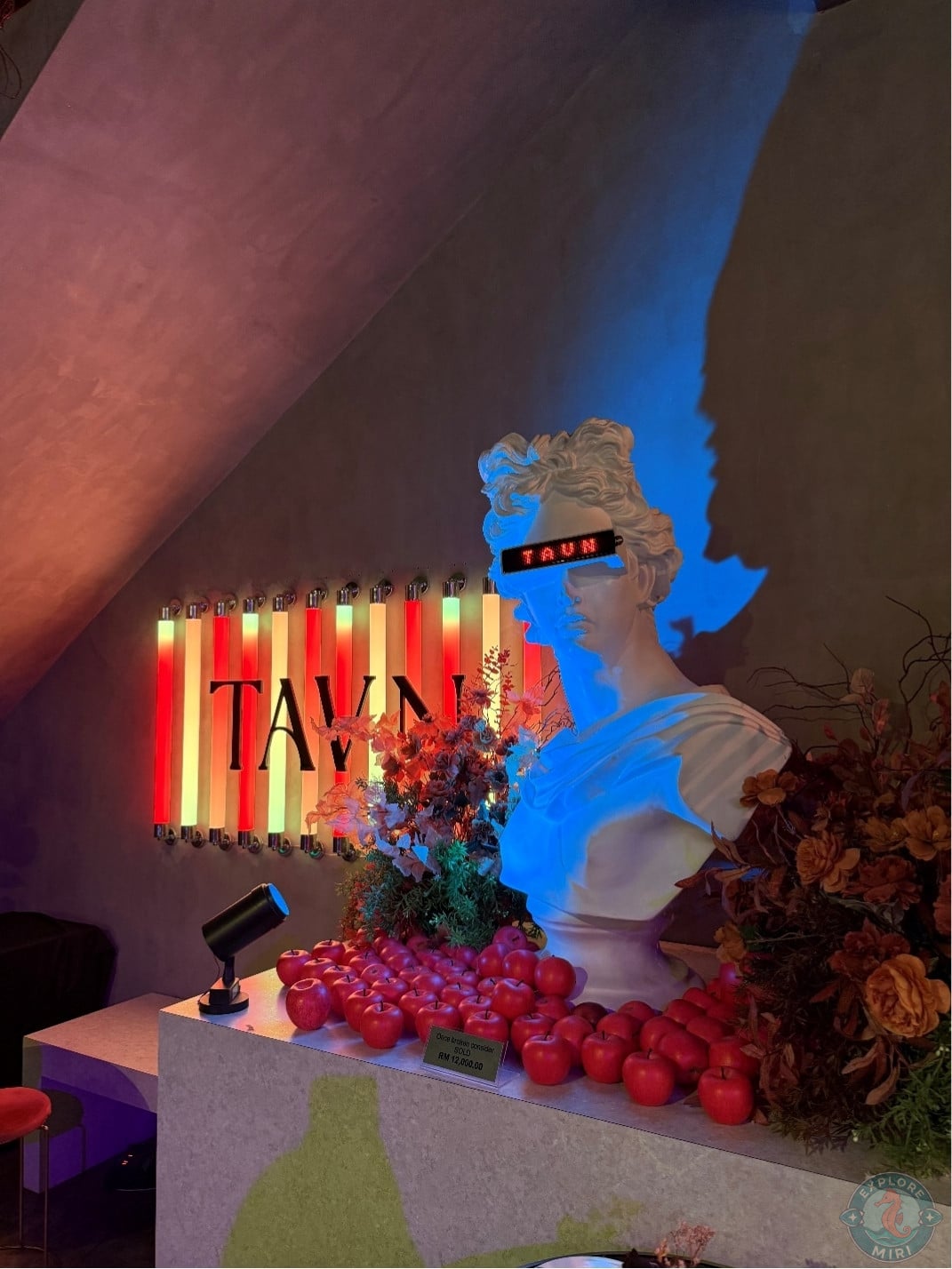 bust beside Tavn sign another look