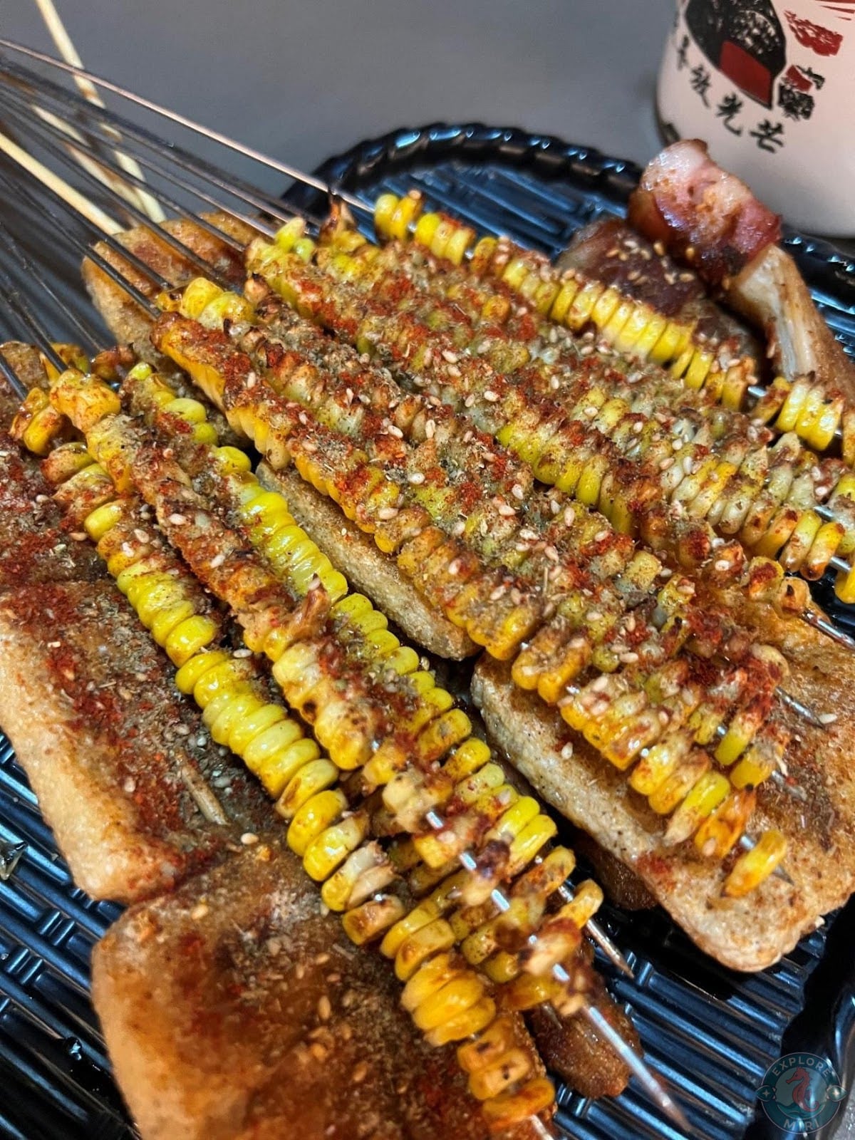corn bbq skewers which was covered in a sauce and spice