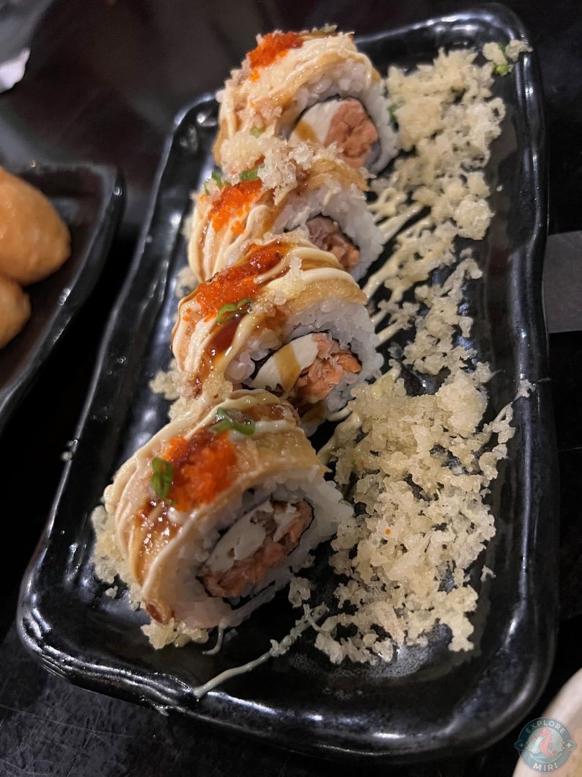 from the specials menu with roe and sauces drizzled on top