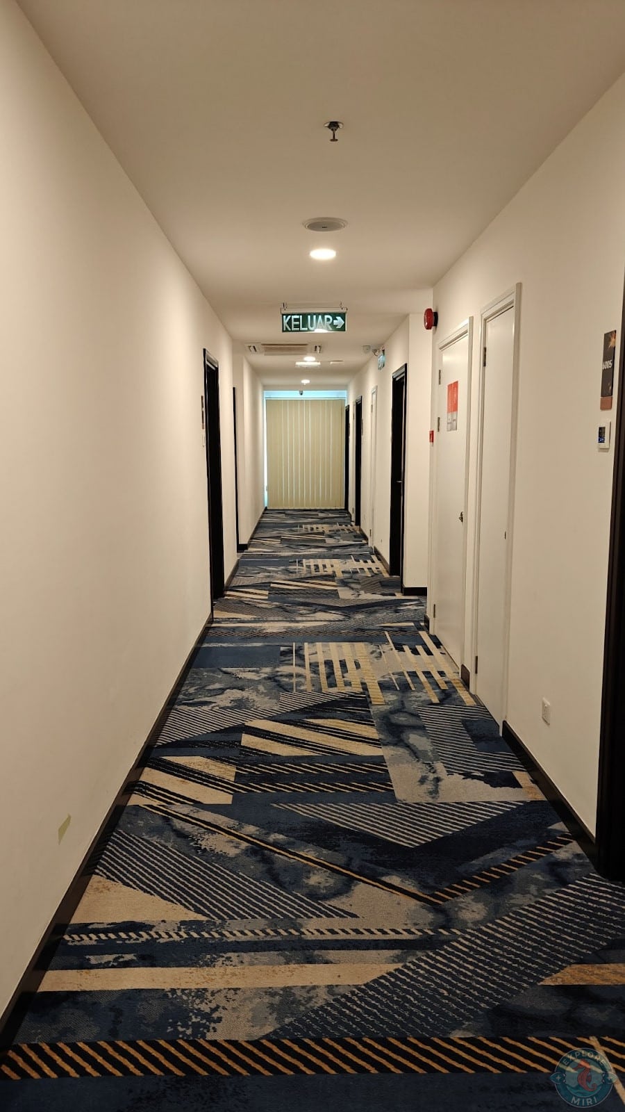 long corridor with rooms on either side