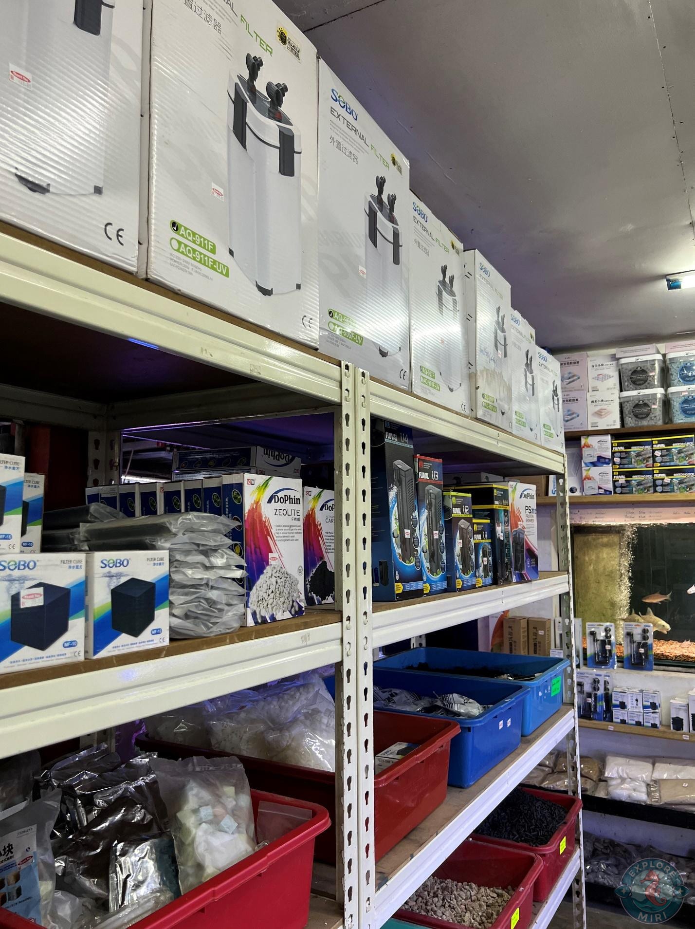 more stacks of aquariums and supplies