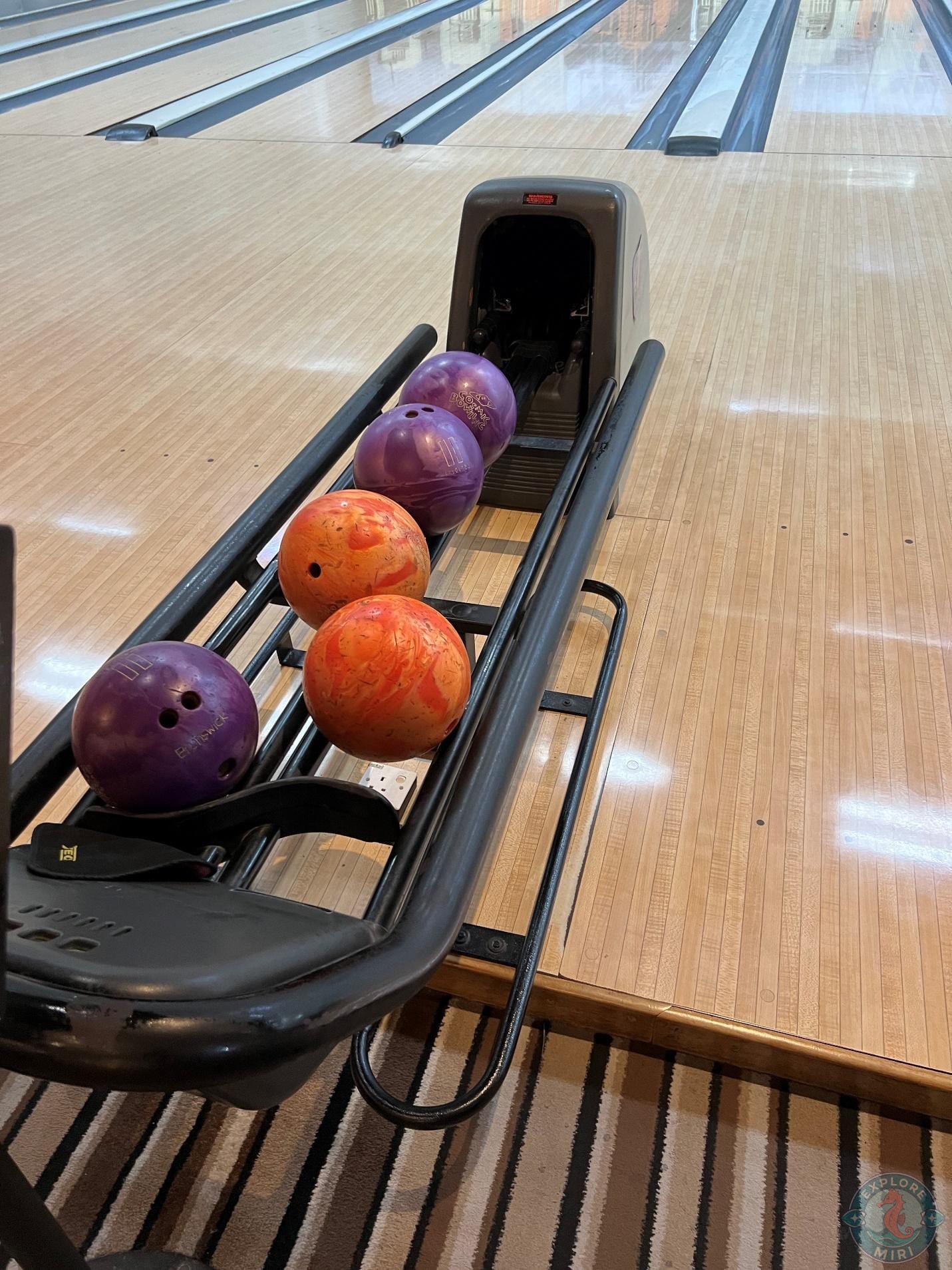 Bowling balls dispensed out of the machine one by one