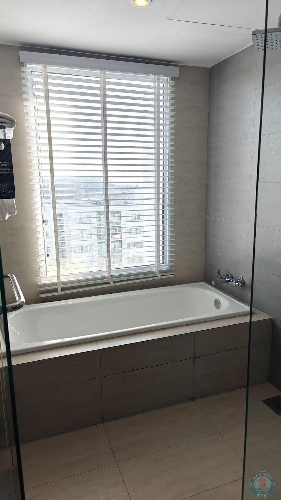 Even the bathroom had a huge window with blinds