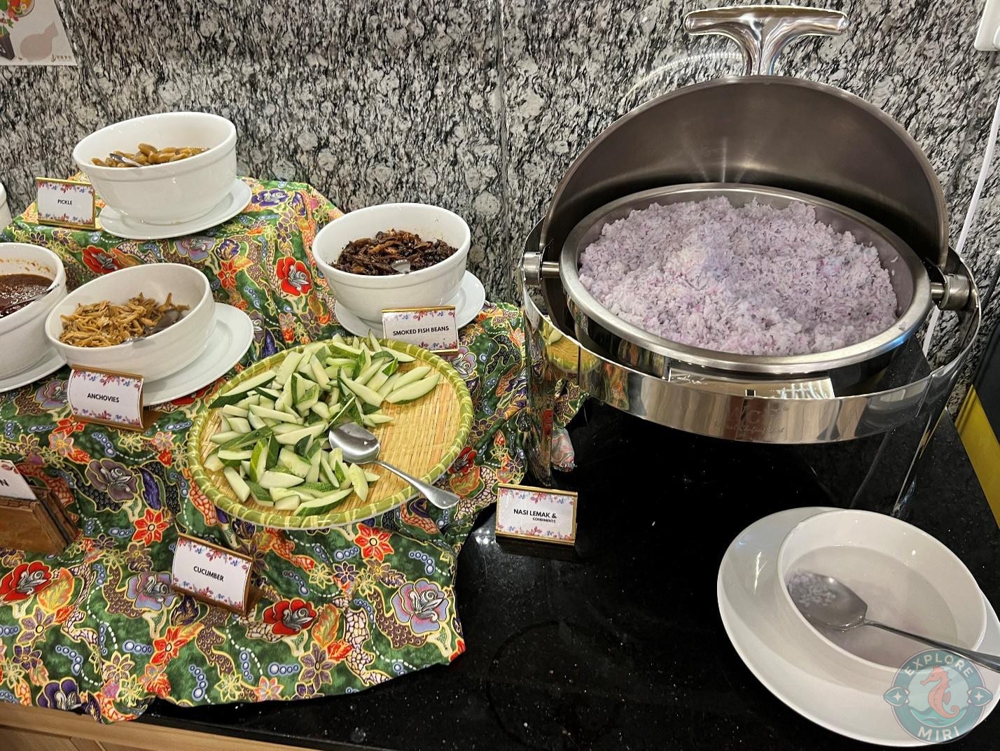 coconut rice with various toppings for a nasi lemak meal