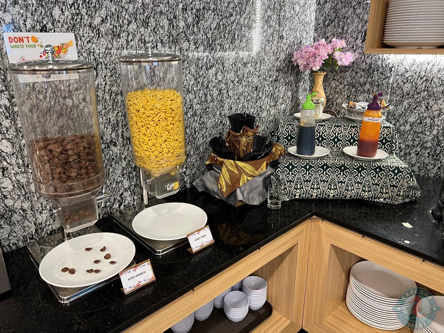 cornflakes and chocoflakes in neatly organized jars to have with milk, honey or sugar