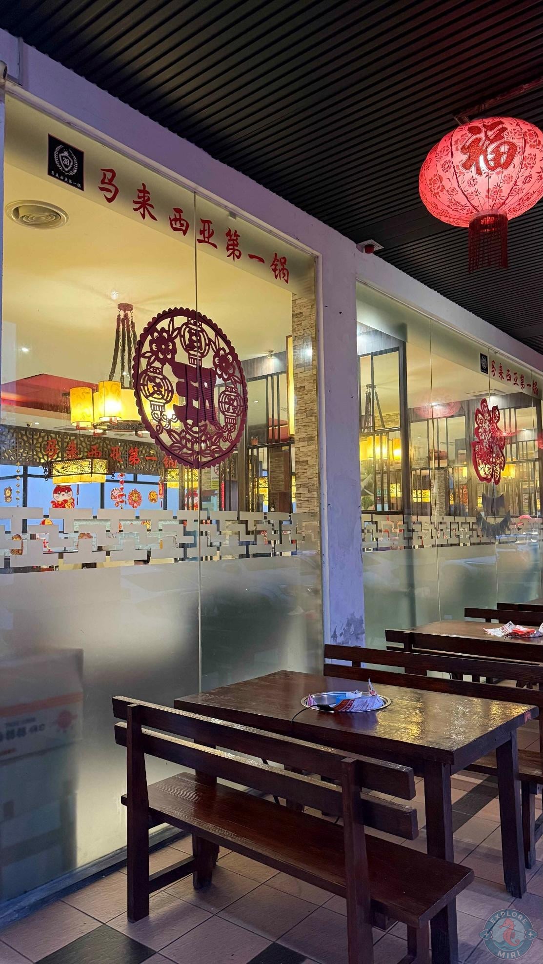 entrance and interior was chinese themed with red decorations and wooden seating area
