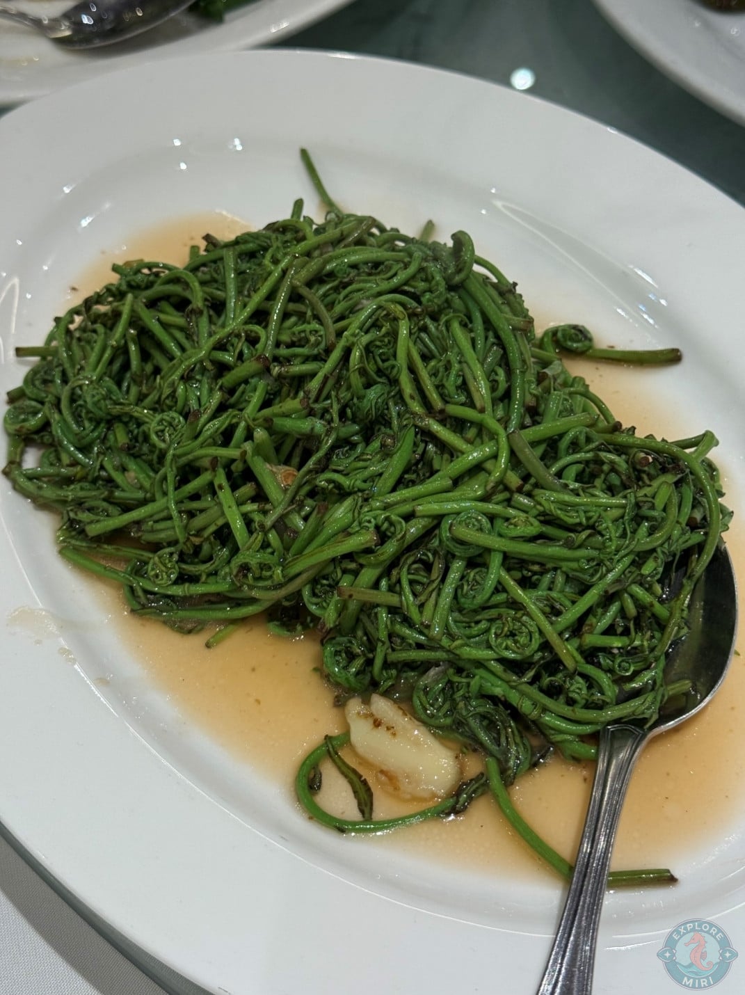 fried midin cooked with garlic