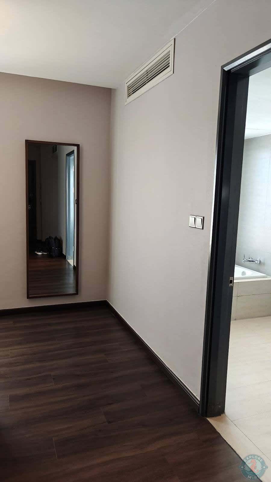 full size mirror was hung on the wall opposite the dressing area