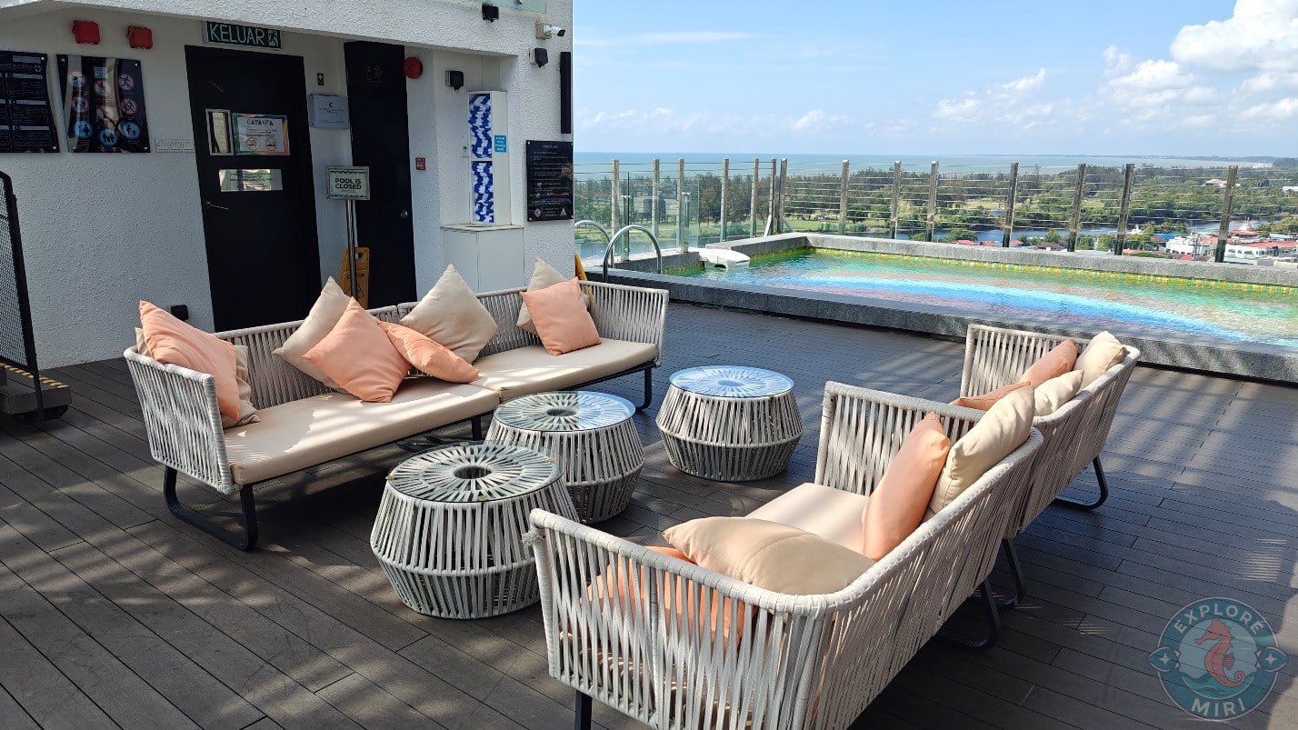 seating area on the deck right next to the pool