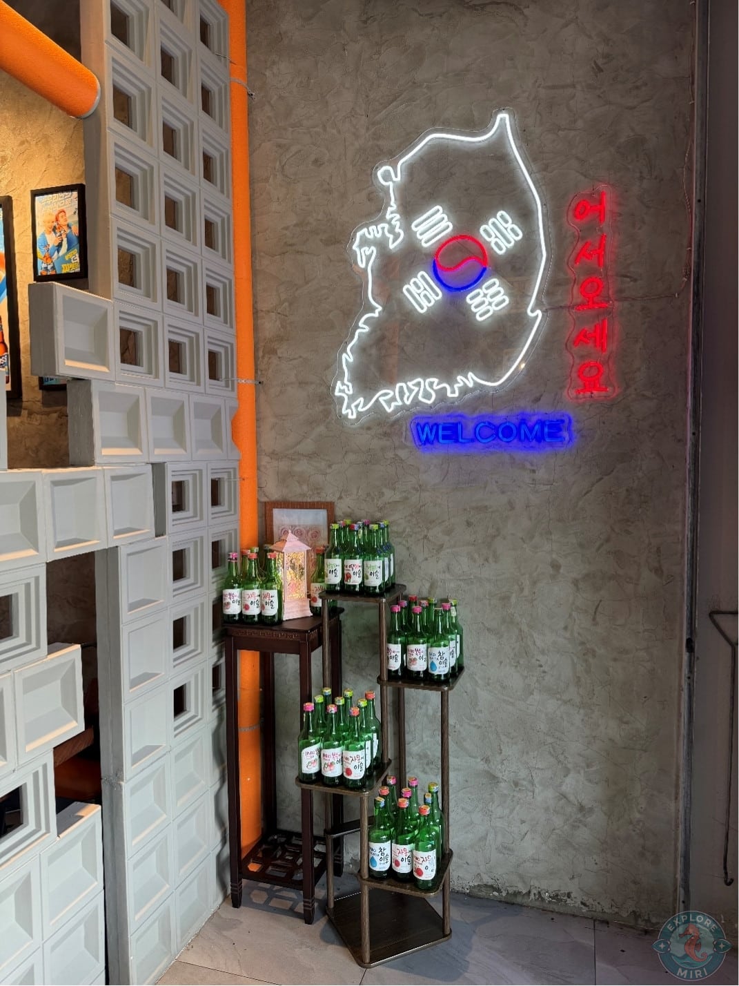soju bottles on a rack in a photospot corner